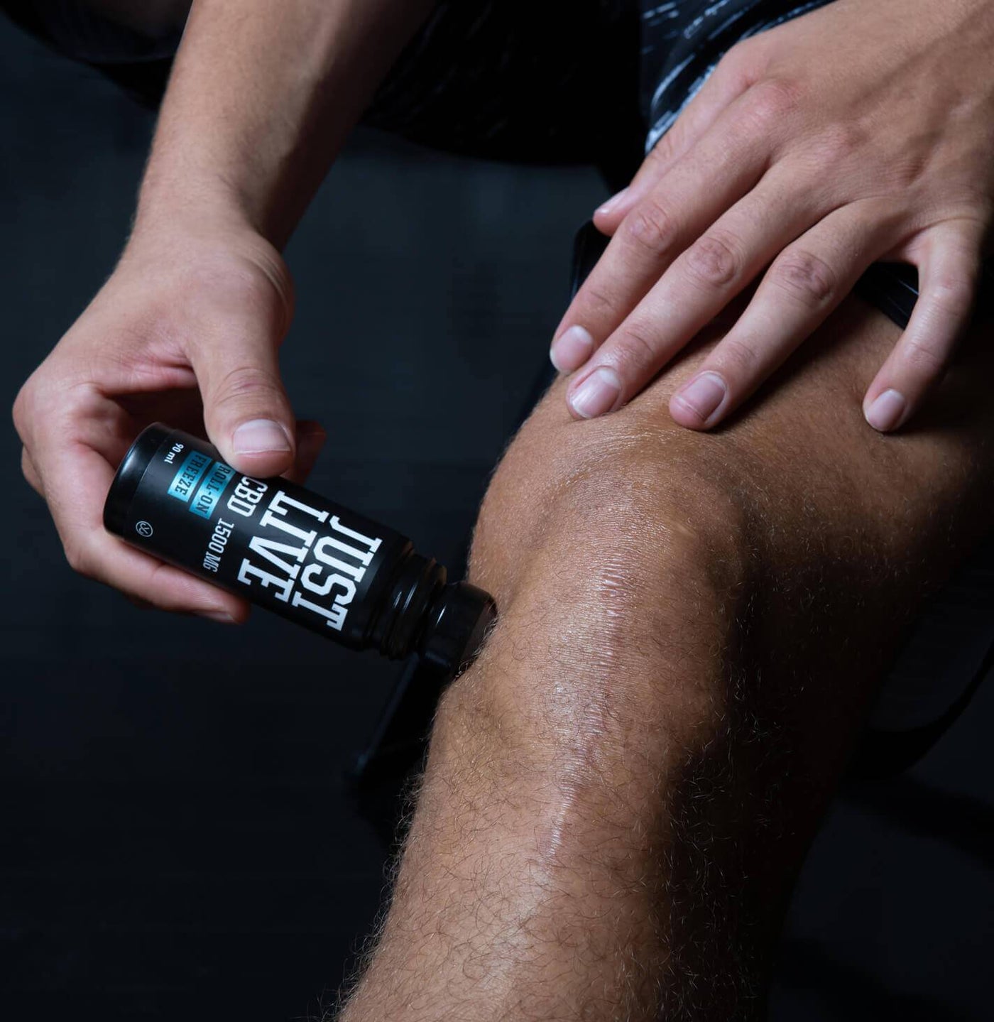 Man Using CBD Roll On For Pain on Knee